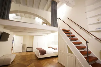 Letto o letti in una camera di Loft moderno vista centro città J House