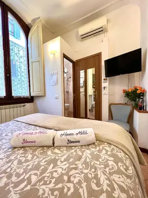 Letto o letti in una camera di Home Milù - Milù Holidays Firenze