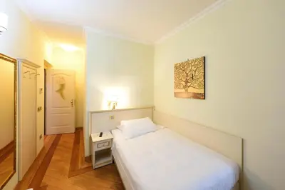 Letto o letti in una camera di Relais La Corte di Cloris