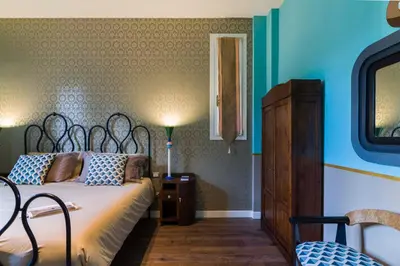 Letto o letti in una camera di Frími Boutique Rooms b&b