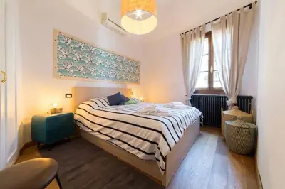 Letto o letti in una camera di Step to Duomo and All the Sights from Refurbished Apartment