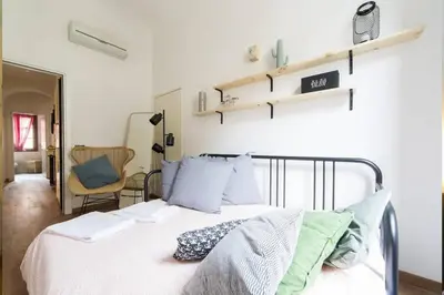 Letto o letti in una camera di Step to Duomo and All the Sights from Refurbished Apartment