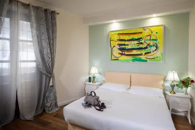 Letto o letti in una camera di Il Terrazzino sulla Cattedrale