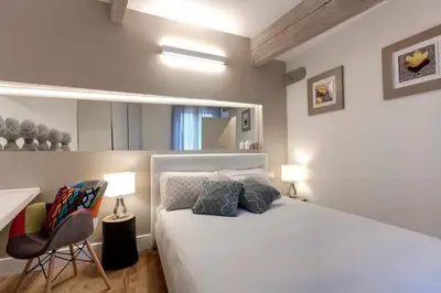 Letto o letti in una camera di Parione Roof Terrace by Mamo Florence