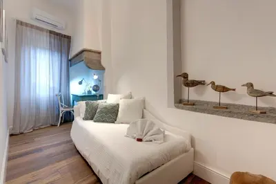 Letto o letti in una camera di Parione Roof Terrace by Mamo Florence