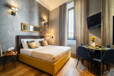 Letto o letti in una camera di Duomo Suites Florence