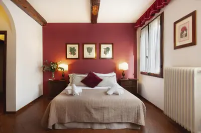 Letto o letti in una camera di S. Spirito Studio Flat