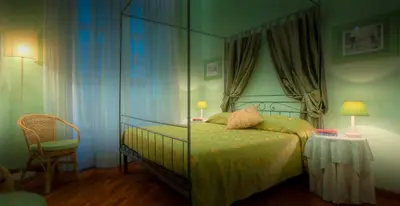 Letto o letti in una camera di Hotel Torre Guelfa Palazzo Acciaiuoli