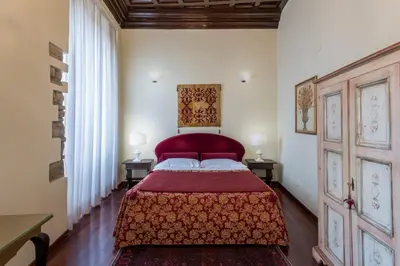 Letto o letti in una camera di Hotel Torre Guelfa Palazzo Acciaiuoli
