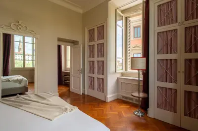 Letto o letti in una camera di Serristori Palace Residence