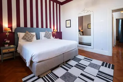 Letto o letti in una camera di Serristori Palace Residence