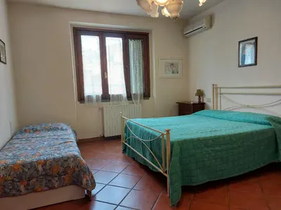 Letto o letti in una camera di Casa Vacanze - La Ginestra