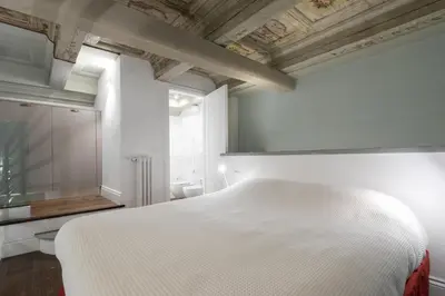 Letto o letti in una camera di Servi Suite