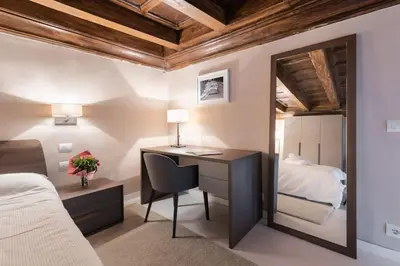 Letto o letti in una camera di Scala Apartments Via Borgo Pinti