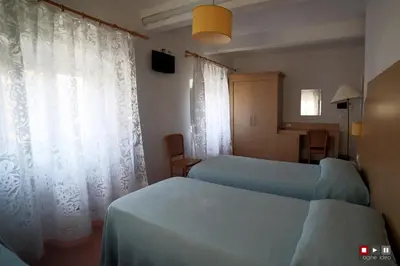 Letto o letti in una camera di Albergo Giugni