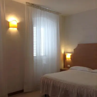 Letto o letti in una camera di Albergo Giugni