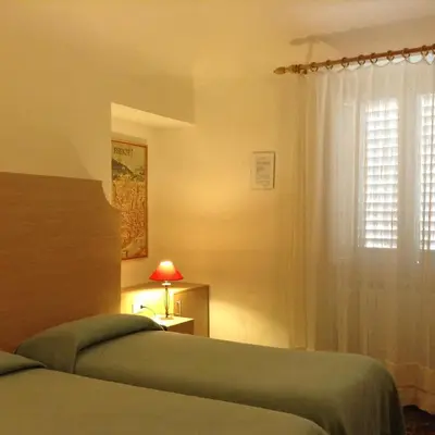 Letto o letti in una camera di Albergo Giugni