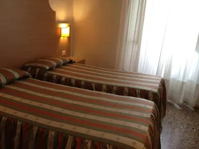 Letto o letti in una camera di Albergo Giugni