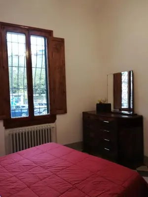 Letto o letti in una camera di la ginella la casa vintage