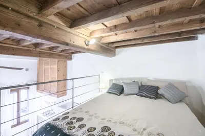 Letto o letti in una camera di San Niccolò Loft by Mmega