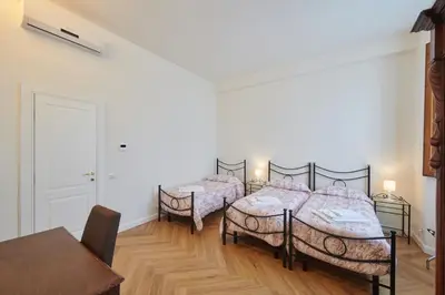 Letto o letti in una camera di Casa Santo Nome di Gesu