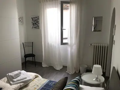 Letto o letti in una camera di Appartamento Firenze Centro Amorino con terrazzo
