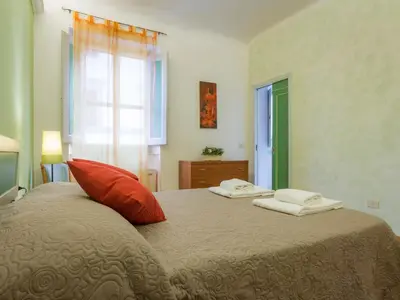 Letto o letti in una camera di Paolo and Carlotta's Home - large and central apartment between two nice parks