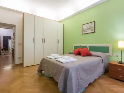 Letto o letti in una camera di Paolo and Carlotta's Home - large and central apartment between two nice parks