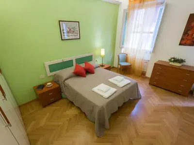 Letto o letti in una camera di Paolo and Carlotta's Home - large and central apartment between two nice parks