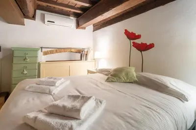 Letto o letti in una camera di Lambertesca Loft by Mmega