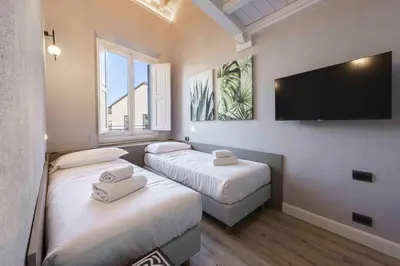 Letto o letti in una camera di Giglio di Firenze by Mmega