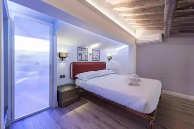Letto o letti in una camera di Giglio di Firenze by Mmega