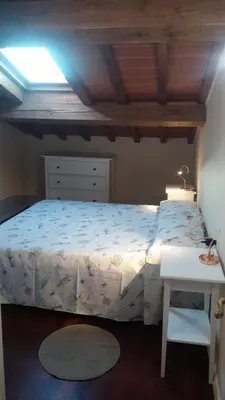 Letto o letti in una camera di la Torretta di Villa Borri Chianti Classico