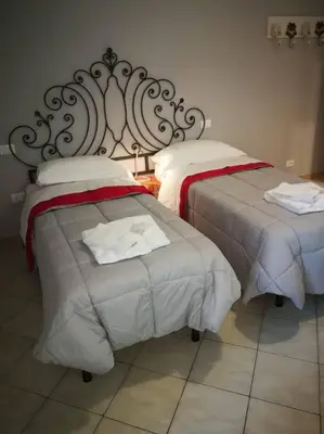 Letto o letti in una camera di B&B BARBERA