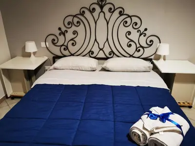 Letto o letti in una camera di B&B BARBERA