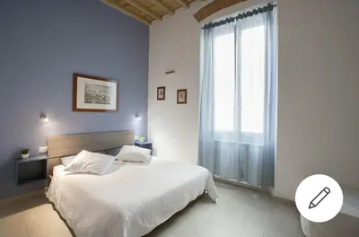 Letto o letti in una camera di LG House with balcony near Ponte Vecchio