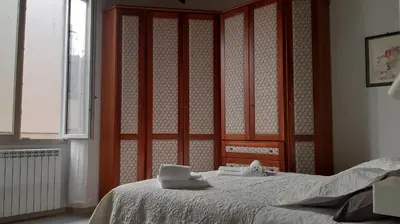 Letto o letti in una camera di LG House with balcony near Ponte Vecchio