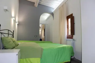 Letto o letti in una camera di Gmax Guelfa Apartments
