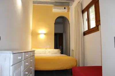 Letto o letti in una camera di Gmax Guelfa Apartments