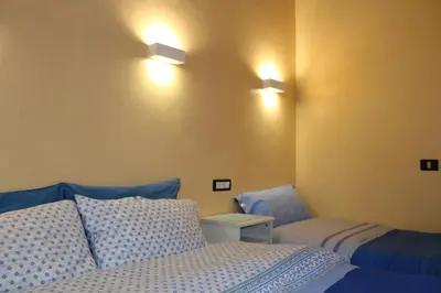 Letto o letti in una camera di Gmax Guelfa Apartments