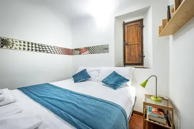 Letto o letti in una camera di Roommo Viola