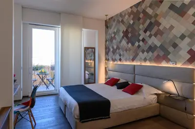 Letto o letti in una camera di B&B The Attico