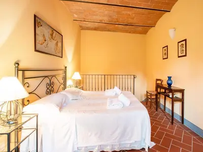 Letto o letti in una camera di Cosy holiday home in Tuscany with shared swimming pool