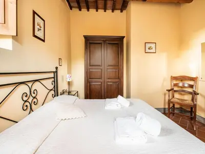 Letto o letti in una camera di Cosy holiday home in Tuscany with shared swimming pool