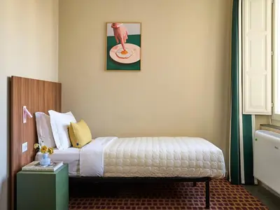 Letto o letti in una camera di Numa Florence Rodo