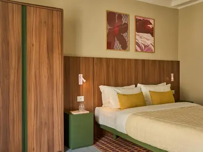 Letto o letti in una camera di Numa Florence Rodo