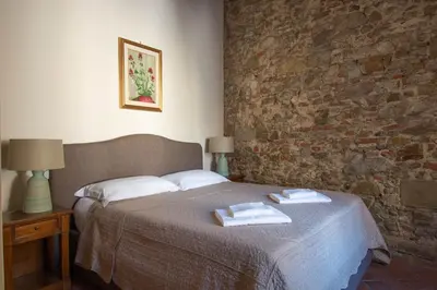 Letto o letti in una camera di Unique Apartment with Private Terrace and Gothic Details
