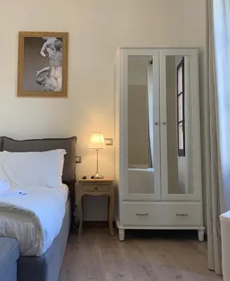Letto o letti in una camera di Domus Plaza