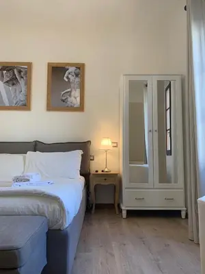 Letto o letti in una camera di Domus Plaza