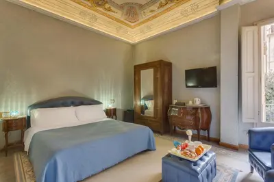 Letto o letti in una camera di B&B Cavour10 Firenze